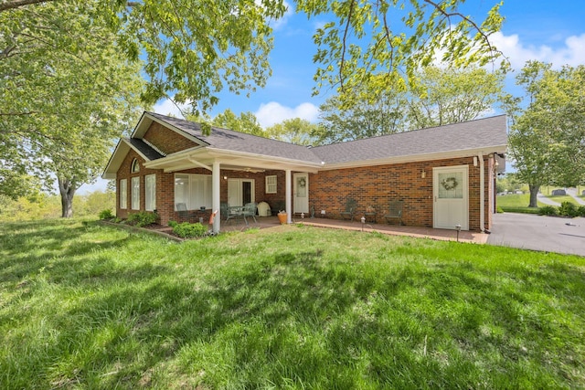 223 Lanetown Rd, Nancy, KY 42544 - view of front of home featuring brick siding, a patio area, roof with shingles, and a front yard