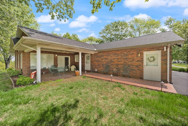223 Lanetown Rd, Nancy, KY 42544 - back of property featuring a yard, brick siding, a patio area, and roof with shingles