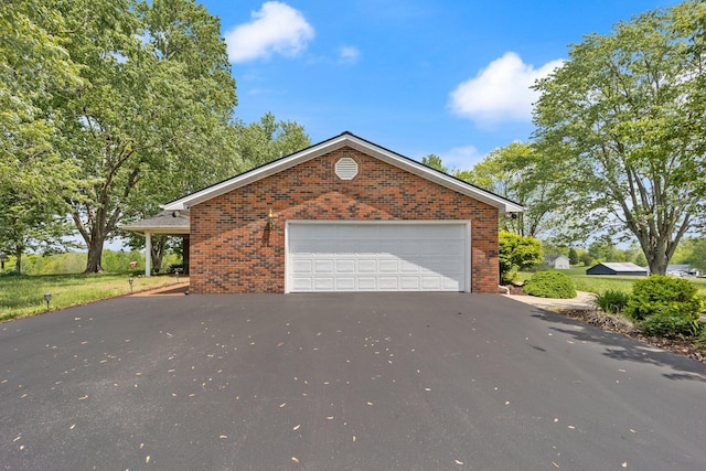 223 Lanetown Rd, Nancy, KY 42544 - view of front of property with brick siding, an attached garage, and aphalt driveway