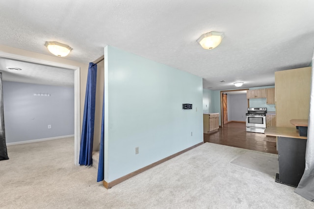 30 Wheeler St, South Shore, KY 41175 - unfurnished living room with baseboards, a textured ceiling, and light carpet