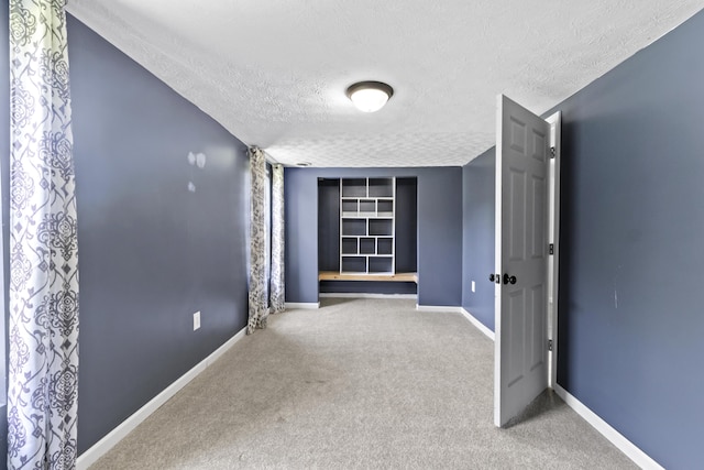 30 Wheeler St, South Shore, KY 41175 - hall with baseboards, carpet, a textured ceiling, and built in shelves
