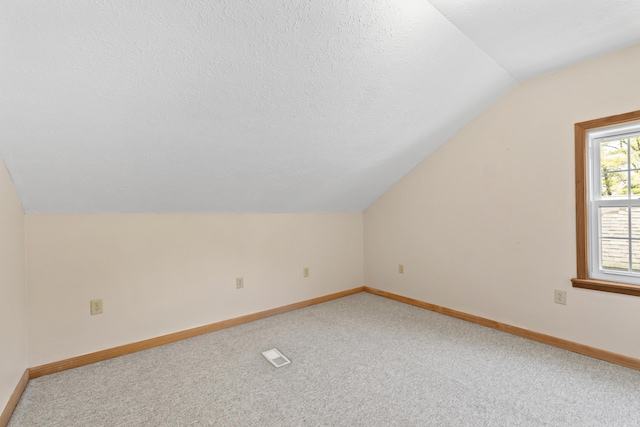 30 Wheeler St, South Shore, KY 41175 - additional living space featuring baseboards, vaulted ceiling, light carpet, and visible vents