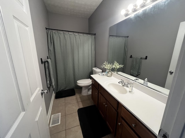 300 Woodlawn Dr, Carrolton, KY 41008 - bathroom with tile patterned floors, vanity, toilet, a textured ceiling, and curtained shower