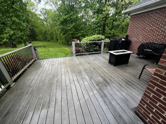 300 Woodlawn Dr, Carrolton, KY 41008 - wooden terrace with an outdoor fire pit, a lawn, and area for grilling
