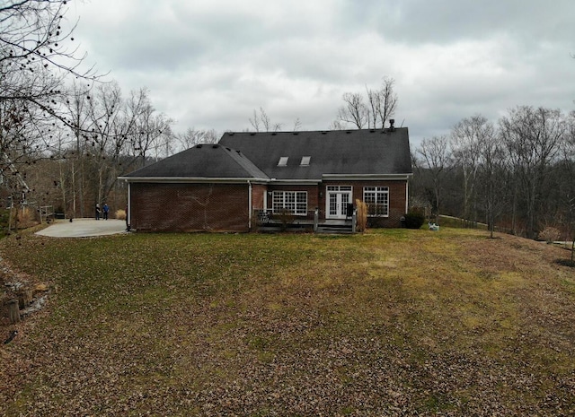 300 Woodlawn Dr, Carrolton, KY 41008 - back of property featuring brick siding, a lawn, and french doors