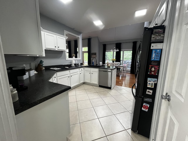 300 Woodlawn Dr, Carrolton, KY 41008 - kitchen with stainless steel dishwasher, a peninsula, light tile patterned flooring, dark countertops, and white cabinetry