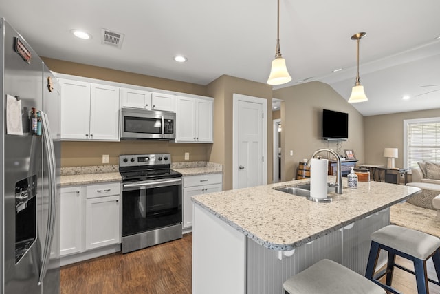 901 Auckland Ave, Richmond, KY 40475 - kitchen featuring appliances with stainless steel finishes, a sink, open floor plan, dark wood-style flooring, and white cabinets