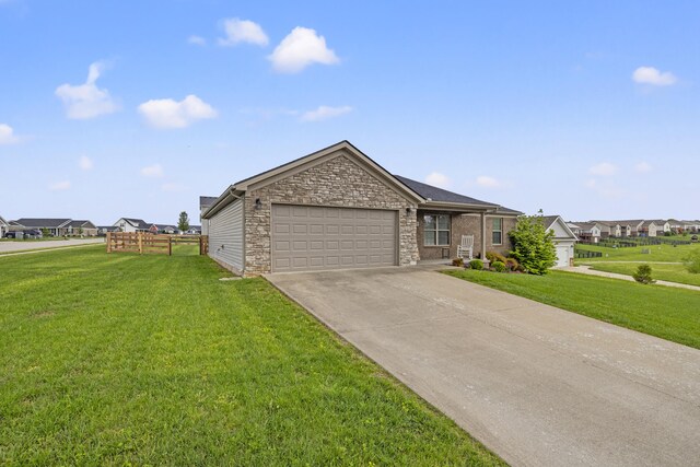 901 Auckland Ave, Richmond, KY 40475 - view of front of house featuring an attached garage, driveway, stone siding, and a residential view
