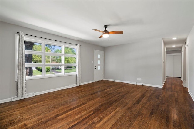 unfurnished living room with visible vents, baseboards, ceiling fan, and wood finished floors