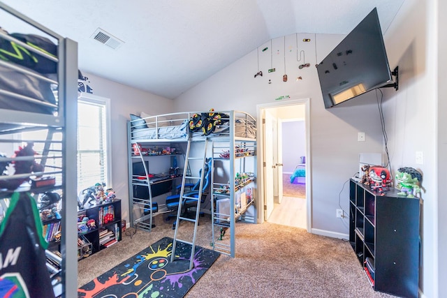bedroom with baseboards, visible vents, carpet, and lofted ceiling