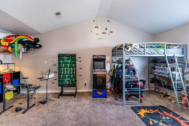 carpeted bedroom with visible vents, a textured ceiling, baseboards, and vaulted ceiling