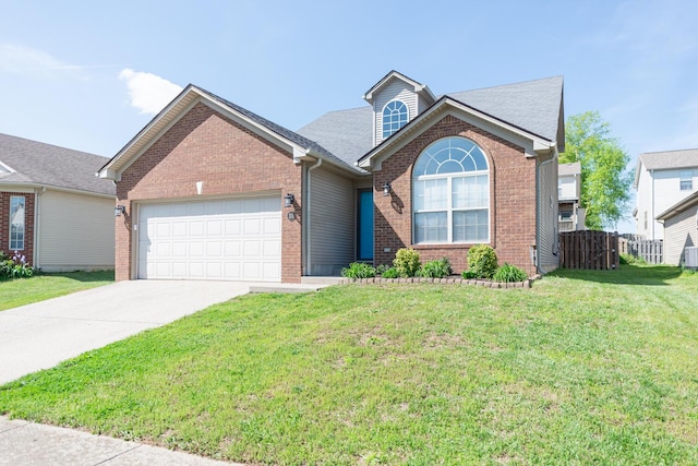 view of front of house with a front lawn, fence, brick siding, an attached garage, and driveway