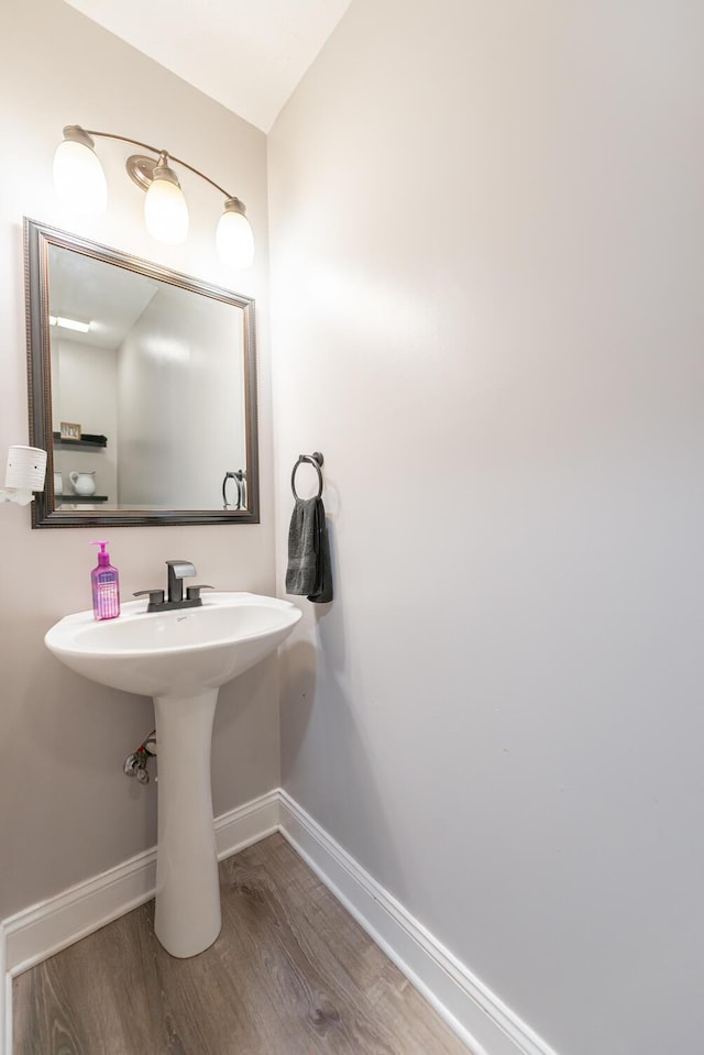 bathroom featuring baseboards and wood finished floors