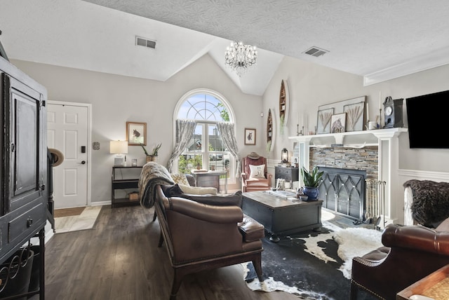 living room featuring a notable chandelier, wood finished floors, and visible vents