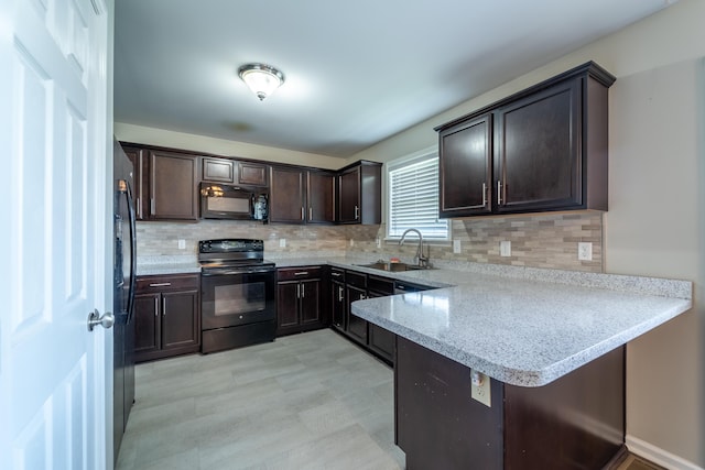 165 Meridian Way, Richmond, KY 40475 - kitchen featuring a peninsula, dark brown cabinets, tasteful backsplash, a sink, and black appliances