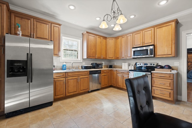 kitchen featuring light countertops, a sink, a chandelier, ornamental molding, and stainless steel appliances
