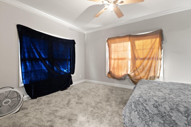 bedroom featuring baseboards, ornamental molding, carpet, and ceiling fan