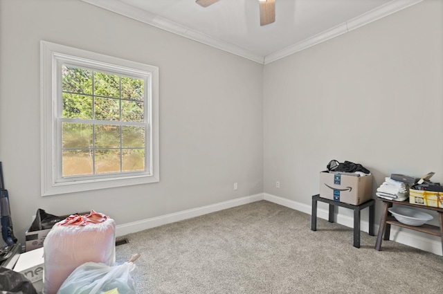 misc room featuring visible vents, ornamental molding, baseboards, ceiling fan, and carpet flooring