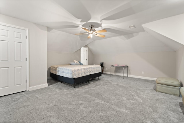 carpeted bedroom featuring baseboards, vaulted ceiling, ceiling fan, and visible vents