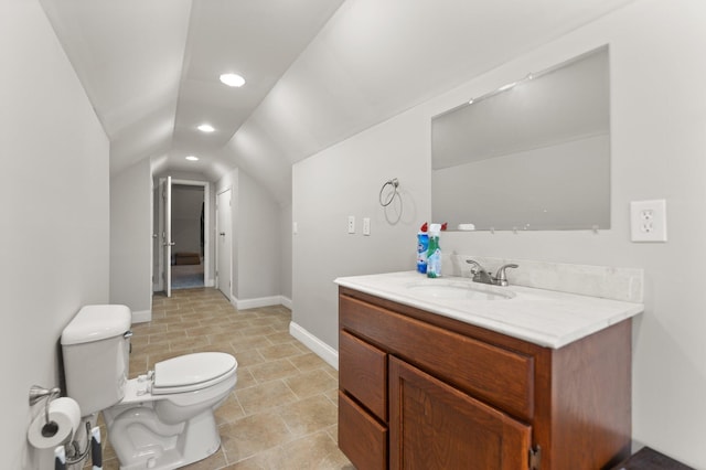 bathroom with vanity, baseboards, toilet, lofted ceiling, and recessed lighting