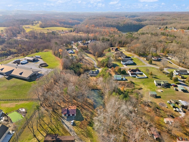 birds eye view of property with a wooded view