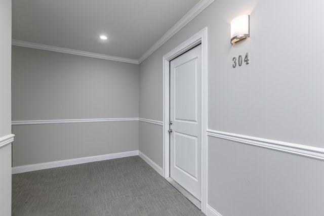 interior space featuring baseboards and crown molding