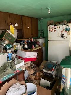 kitchen featuring freestanding refrigerator
