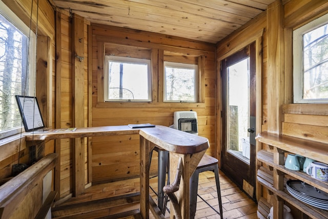 sunroom / solarium featuring heating unit