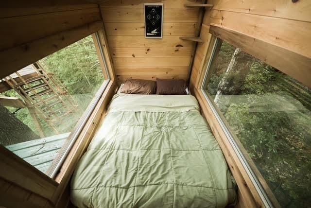 unfurnished bedroom featuring wood walls