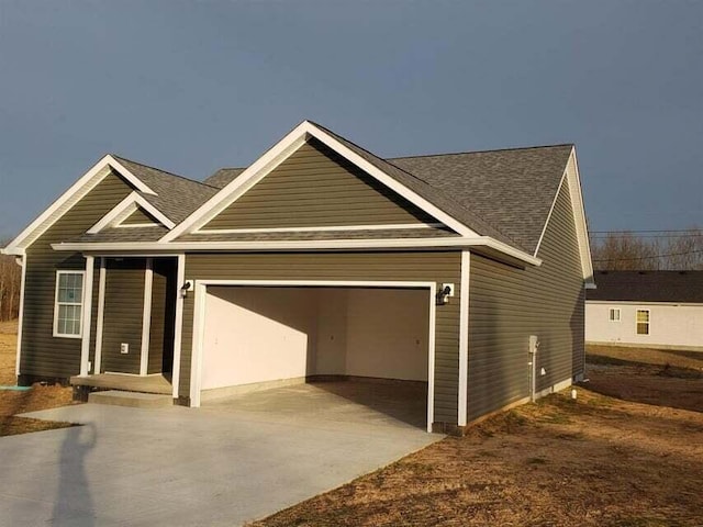 1620 Hannah Dr, Lawrenceburg, KY 40342 - view of front of home featuring roof with shingles, an attached garage, driveway, and a front lawn