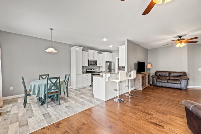 1620 Hannah Dr, Lawrenceburg, KY 40342 - kitchen with open floor plan, appliances with stainless steel finishes, and ceiling fan
