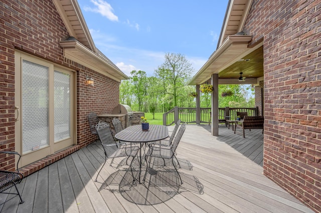 deck with a ceiling fan and outdoor dining space