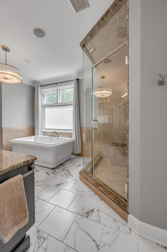 full bathroom featuring visible vents, a freestanding bath, a shower stall, vanity, and marble finish floor