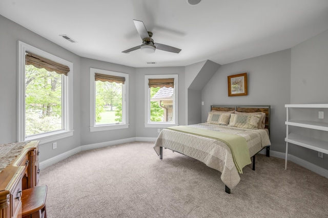 bedroom featuring baseboards, carpet, a ceiling fan, and visible vents