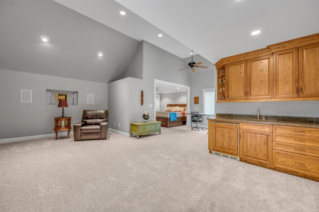kitchen with baseboards, recessed lighting, ceiling fan, and light colored carpet