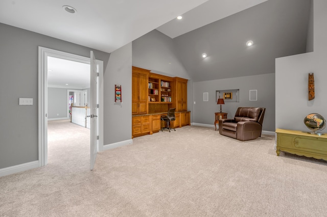 sitting room with recessed lighting, baseboards, light carpet, and built in study area
