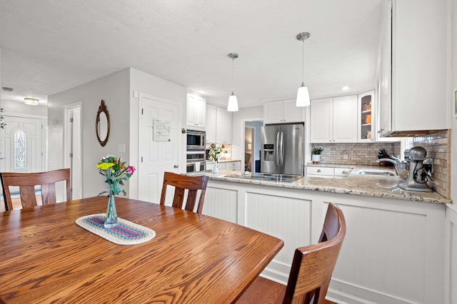 dining area with wood finished floors