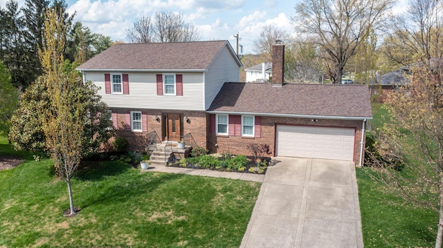 traditional-style home featuring brick siding, an attached garage, a chimney, and concrete driveway