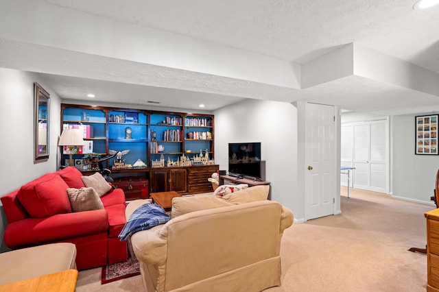 carpeted living area featuring recessed lighting, a textured ceiling, and baseboards