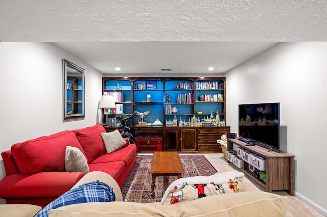 living room with carpet flooring, recessed lighting, and a textured ceiling