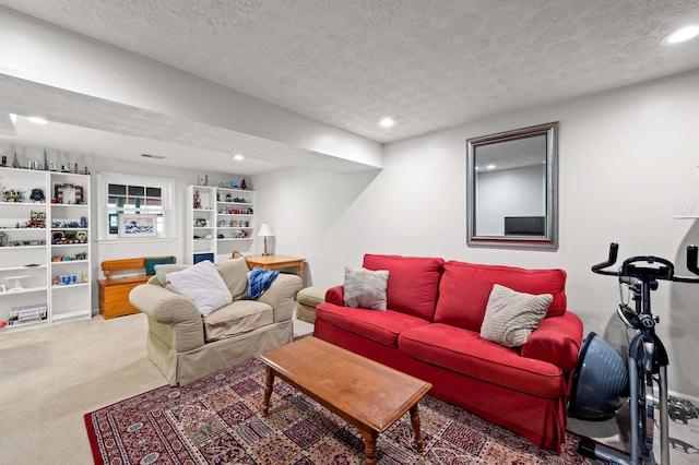 living room with carpet, recessed lighting, and a textured ceiling