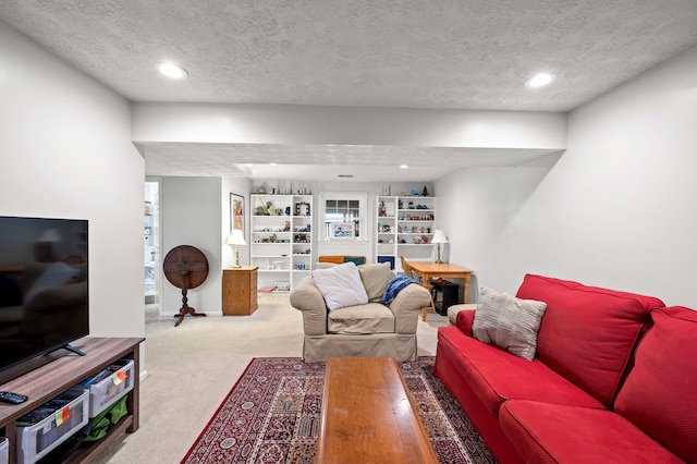 living area with carpet flooring, recessed lighting, and a textured ceiling