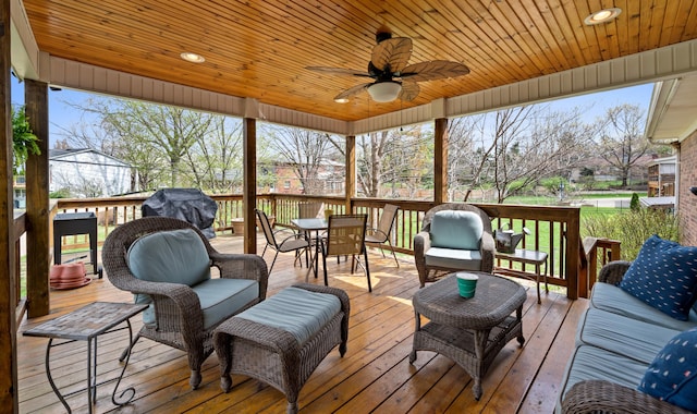 wooden deck with a ceiling fan and outdoor dining area