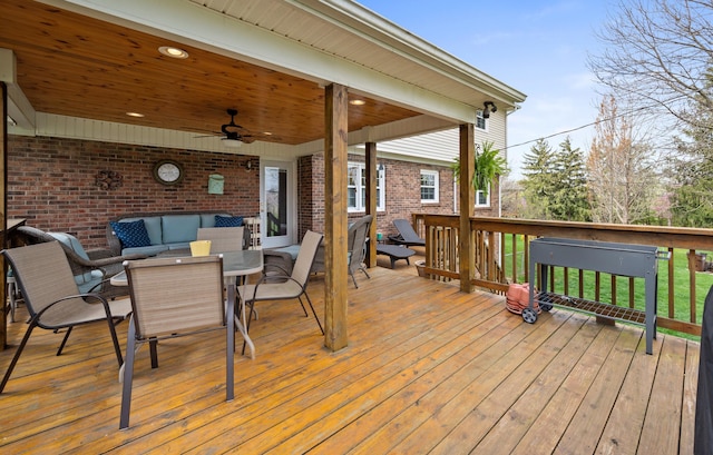 deck with a ceiling fan, outdoor lounge area, and outdoor dining space