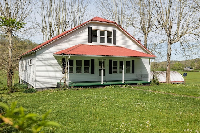 534 Lower Gilmore Rd, Campton, KY 41301 - view of front of home with a porch, a front yard, and metal roof