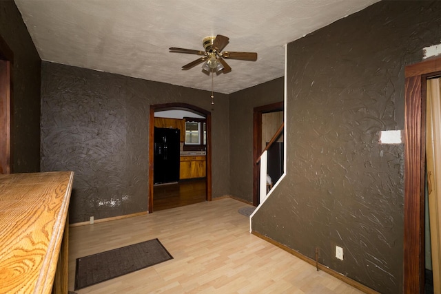 534 Lower Gilmore Rd, Campton, KY 41301 - hall featuring arched walkways, baseboards, and wood finished floors