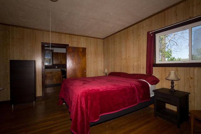 534 Lower Gilmore Rd, Campton, KY 41301 - bedroom featuring dark wood-style flooring and wood walls