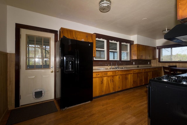 534 Lower Gilmore Rd, Campton, KY 41301 - kitchen featuring brown cabinetry, black fridge, a sink, dark wood finished floors, and gas stove