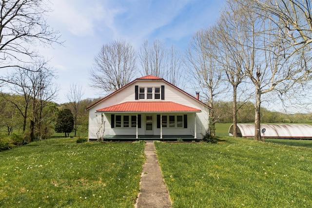 534 Lower Gilmore Rd, Campton, KY 41301 - view of front of house with a front yard and metal roof