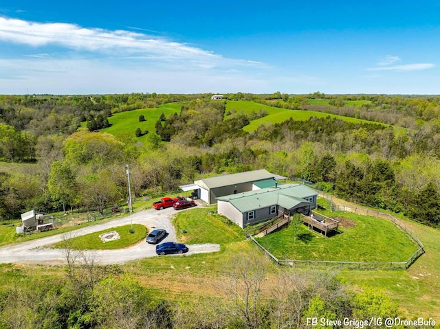 980 Persimmon Ridge Rd, Carlisle, KY 40311 - drone / aerial view featuring a wooded view
